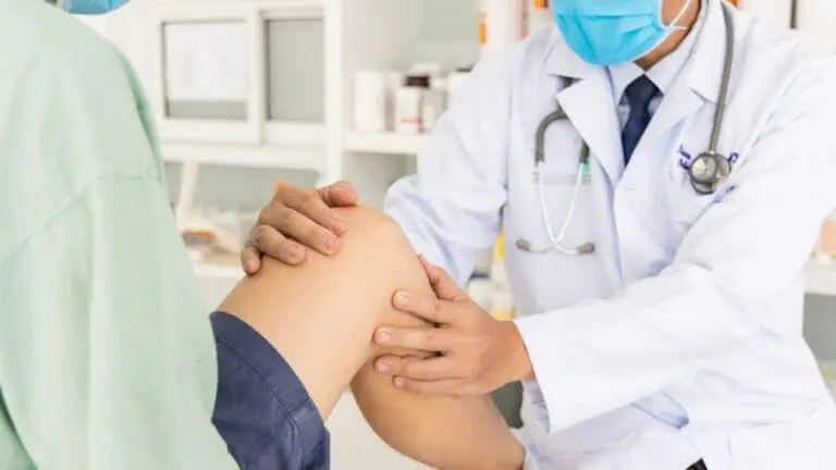 doctor working on a person's knee